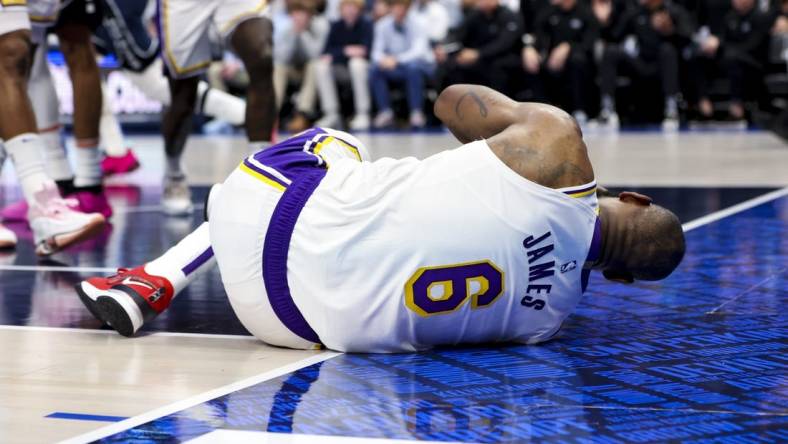 Feb 26, 2023; Dallas, Texas, USA; Los Angeles Lakers forward LeBron James (6) lays on the floor injured during the second half against the Dallas Mavericks at American Airlines Center. Mandatory Credit: Kevin Jairaj-USA TODAY Sports