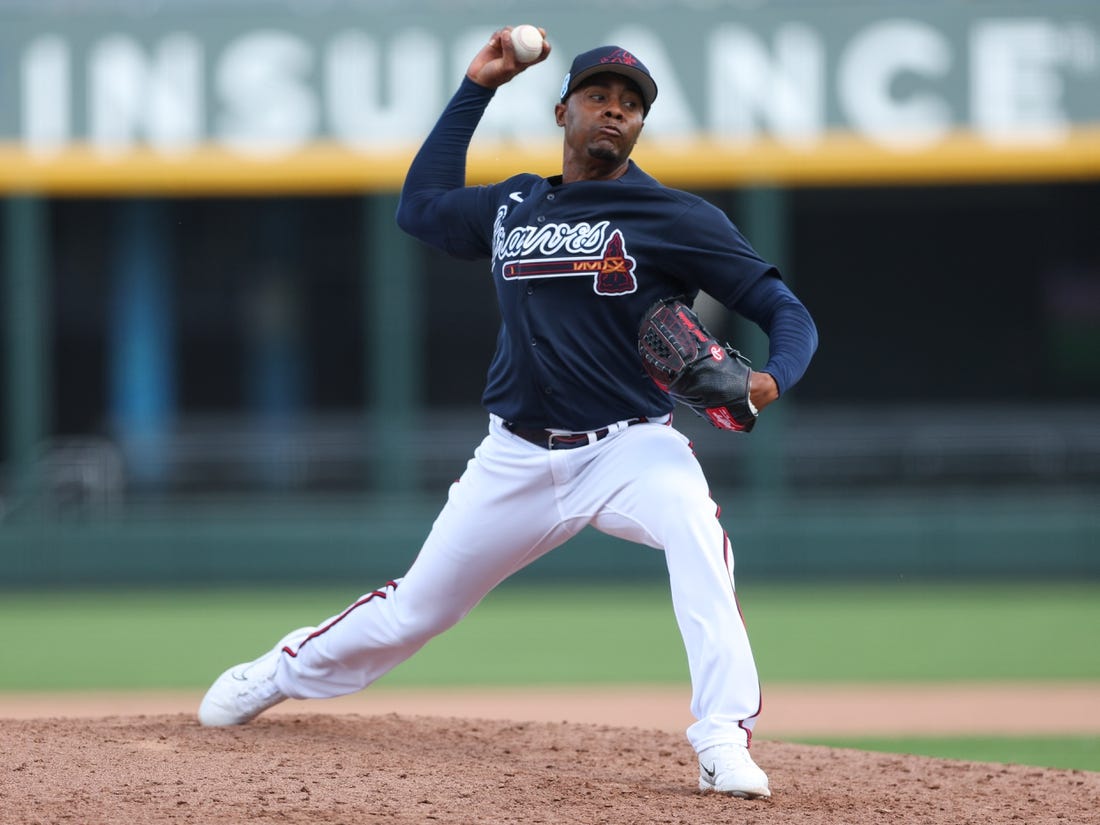 Feb 27, 2023; North Port, Florida, USA;  Atlanta Braves relief pitcher Raisel Iglesias (26) throws a pitch against the Toronto Blue Jays in the fifth inning during spring training at CoolToday Park. Mandatory Credit: Nathan Ray Seebeck-USA TODAY Sports