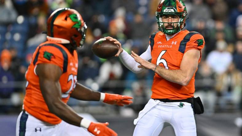 Feb 23, 2023; Seattle, WA, USA; Seattle Sea Dragons quarterback Ben DiNucci (6) and Seattle Sea Dragons running back Morgan Ellison (25) during the second half at Lumen Field. St. Louis defeated Seattle 20-18. Mandatory Credit: Steven Bisig-USA TODAY Sports