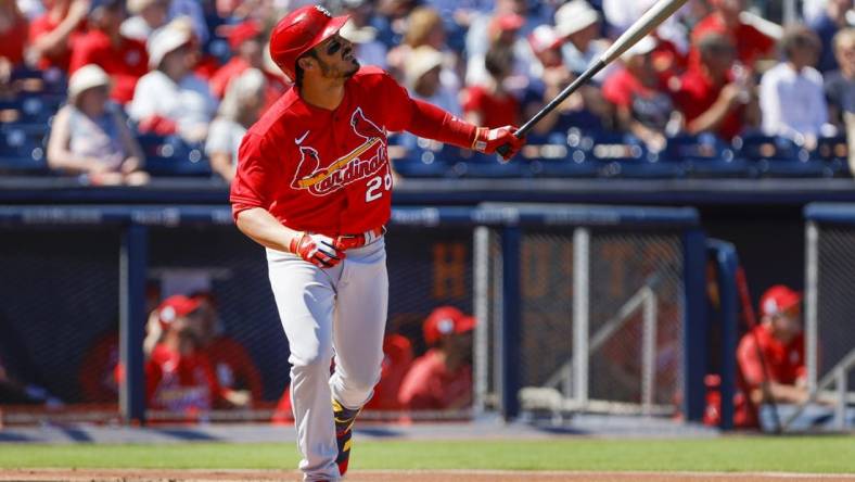 Feb 28, 2023; West Palm Beach, Florida, USA; St. Louis Cardinals third baseman Nolan Arenado (28) hits a home run during the first inning against the Washington Nationals at The Ballpark of the Palm Beaches. Mandatory Credit: Sam Navarro-USA TODAY Sports