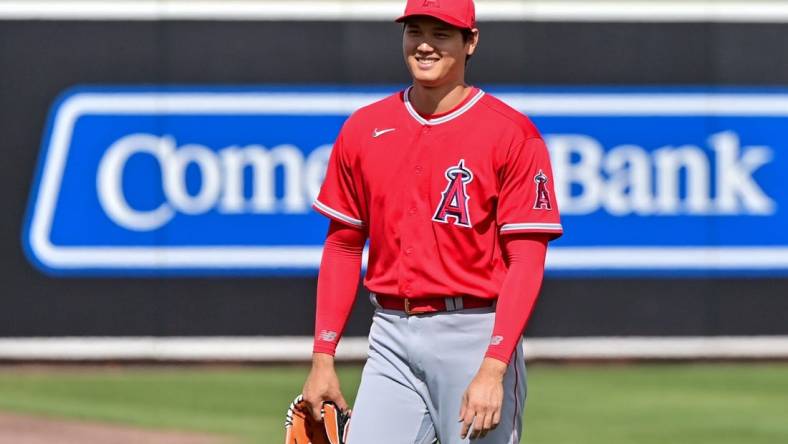 Feb 28, 2023; Mesa, Arizona, USA; Los Angeles Angels starting pitcher Shohei Ohtani (17) looks on prior to the game against the Oakland Athletics during a Spring Training game at Hohokam Stadium. Mandatory Credit: Matt Kartozian-USA TODAY Sports