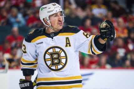 Feb 28, 2023; Calgary, Alberta, CAN; Boston Bruins left wing Brad Marchand (63) reacts during the second period against the Calgary Flames at Scotiabank Saddledome. Mandatory Credit: Sergei Belski-USA TODAY Sports