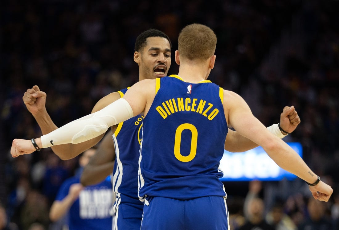 Feb 28, 2023; San Francisco, California, USA; Golden State Warriors guard Jordan Poole (left) and teammate Donte DiVincenzo (0) celebrate during the fourth quarter against the Portland Trail Blazers at Chase Center. Mandatory Credit: D. Ross Cameron-USA TODAY Sports