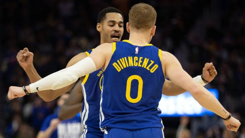 Feb 28, 2023; San Francisco, California, USA; Golden State Warriors guard Jordan Poole (left) and teammate Donte DiVincenzo (0) celebrate during the fourth quarter against the Portland Trail Blazers at Chase Center. Mandatory Credit: D. Ross Cameron-USA TODAY Sports