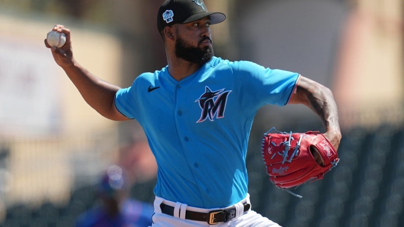 Mar 1, 2023; Jupiter, Florida, USA; Miami Marlins starting pitcher Sandy Alcantara (22) pitches against the New York Mets in the second inning at Roger Dean Stadium. Mandatory Credit: Jim Rassol-USA TODAY Sports