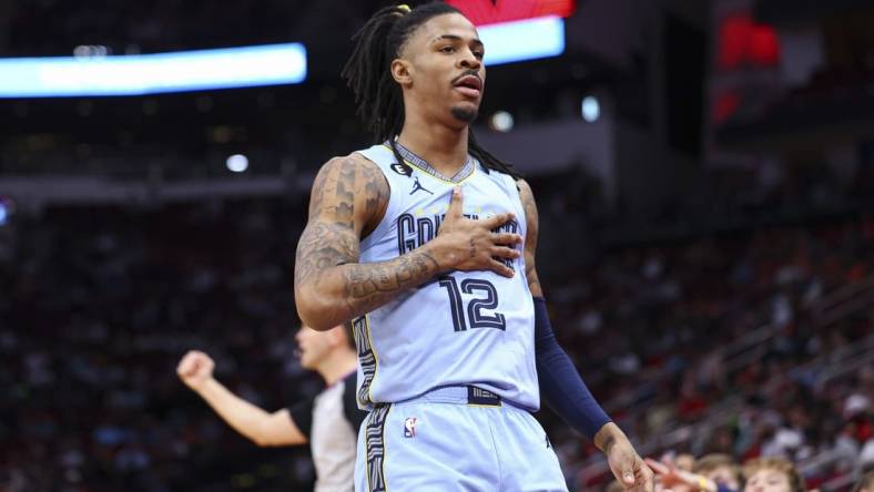 Mar 1, 2023; Houston, Texas, USA; Memphis Grizzlies guard Ja Morant (12) reacts after scoring a basket during the first quarter against the Houston Rockets at Toyota Center. Mandatory Credit: Troy Taormina-USA TODAY Sports