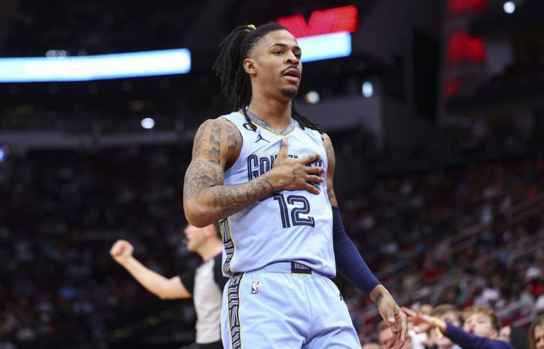 Mar 1, 2023; Houston, Texas, USA; Memphis Grizzlies guard Ja Morant (12) reacts after scoring a basket during the first quarter against the Houston Rockets at Toyota Center. Mandatory Credit: Troy Taormina-USA TODAY Sports