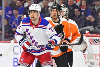 Mar 1, 2023; Philadelphia, Pennsylvania, USA; New York Rangers center Filip Chytil (72) and Philadelphia Flyers defenseman Tony DeAngelo (77) battle for position during the first period at Wells Fargo Center. Mandatory Credit: Eric Hartline-USA TODAY Sports