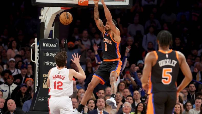 Mar 1, 2023; New York, New York, USA; New York Knicks forward Obi Toppin (1) dunks against Brooklyn Nets forward Joe Harris (12) during the second quarter at Madison Square Garden. Mandatory Credit: Brad Penner-USA TODAY Sports