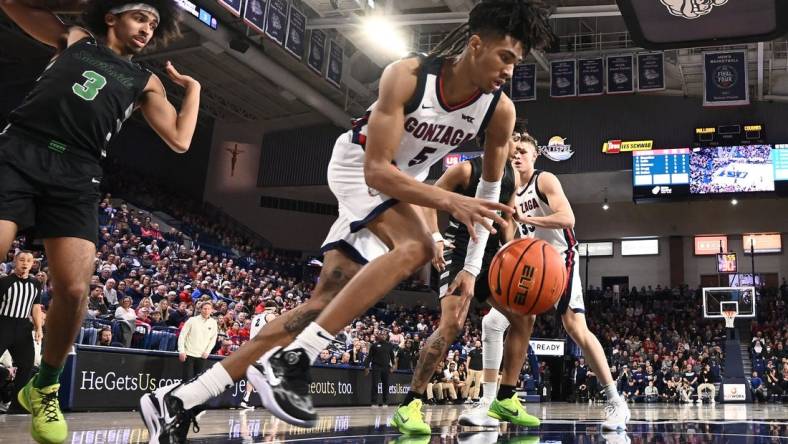 Mar 1, 2023; Spokane, Washington, USA; Gonzaga Bulldogs guard Hunter Sallis (5) rebounds the ball against the Chicago State Cougars in the first half at McCarthey Athletic Center. Mandatory Credit: James Snook-USA TODAY Sports