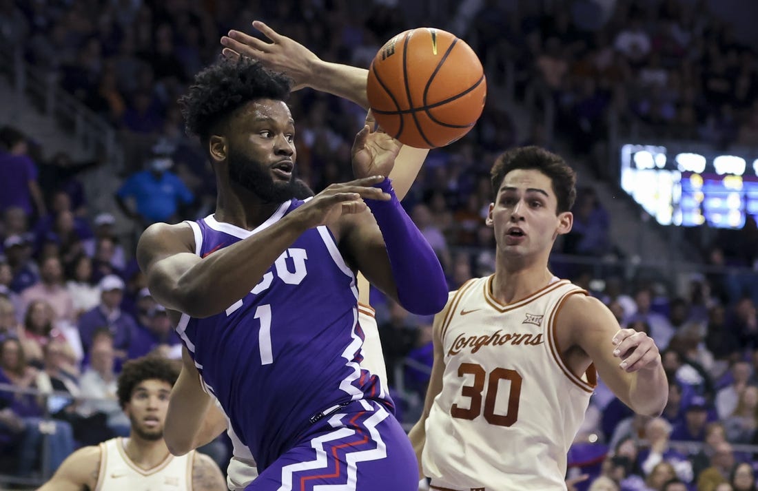 Mar 1, 2023; Fort Worth, Texas, USA;  TCU Horned Frogs guard Mike Miles Jr. (1) passes teh ball in front of Texas Longhorns forward Brock Cunningham (30) during the first half at Ed and Rae Schollmaier Arena. Mandatory Credit: Kevin Jairaj-USA TODAY Sports