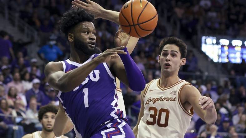 Mar 1, 2023; Fort Worth, Texas, USA;  TCU Horned Frogs guard Mike Miles Jr. (1) passes teh ball in front of Texas Longhorns forward Brock Cunningham (30) during the first half at Ed and Rae Schollmaier Arena. Mandatory Credit: Kevin Jairaj-USA TODAY Sports