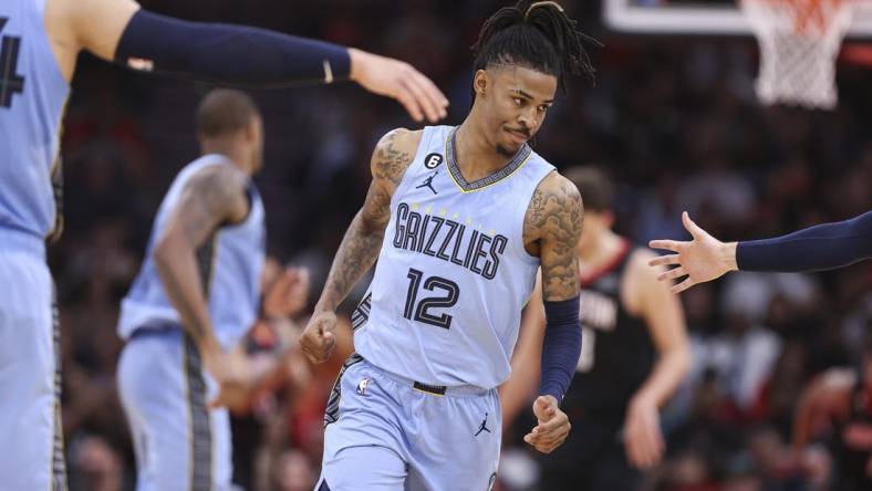 Mar 1, 2023; Houston, Texas, USA; Memphis Grizzlies guard Ja Morant (12) reacts after scoring a basket during the third quarter against the Houston Rockets at Toyota Center. Mandatory Credit: Troy Taormina-USA TODAY Sports