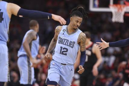 Mar 1, 2023; Houston, Texas, USA; Memphis Grizzlies guard Ja Morant (12) reacts after scoring a basket during the third quarter against the Houston Rockets at Toyota Center. Mandatory Credit: Troy Taormina-USA TODAY Sports