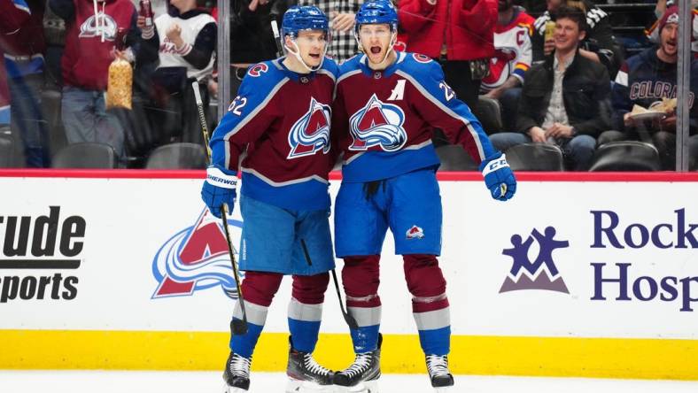 Mar 1, 2023; Denver, Colorado, USA; Colorado Avalanche center Nathan MacKinnon (29) celebrates his goal with left wing Artturi Lehkonen (62) in the second period against the New Jersey Devils at Ball Arena. Mandatory Credit: Ron Chenoy-USA TODAY Sports