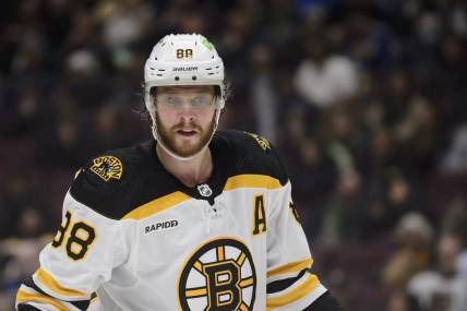 Feb 25, 2023; Vancouver, British Columbia, CAN;  Boston Bruins forward David Pastrnak  (88) awaits the start of play against the Vancouver Canucks during the second period at Rogers Arena. Mandatory Credit: Anne-Marie Sorvin-USA TODAY Sports