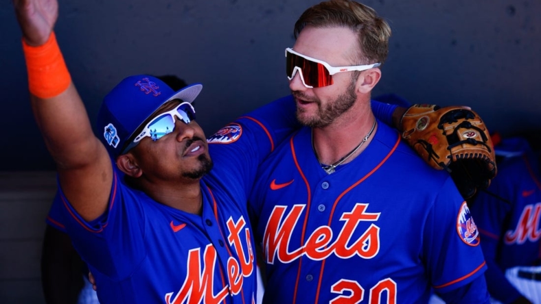 Mar 2, 2023; Port St. Lucie, Florida, USA; New York Mets third baseman Eduardo Escobar (10) and  first baseman Pete Alonso (20) embrace prior to a game against the Atlanta Braves at Clover Park. Mandatory Credit: Rich Storry-USA TODAY Sports
