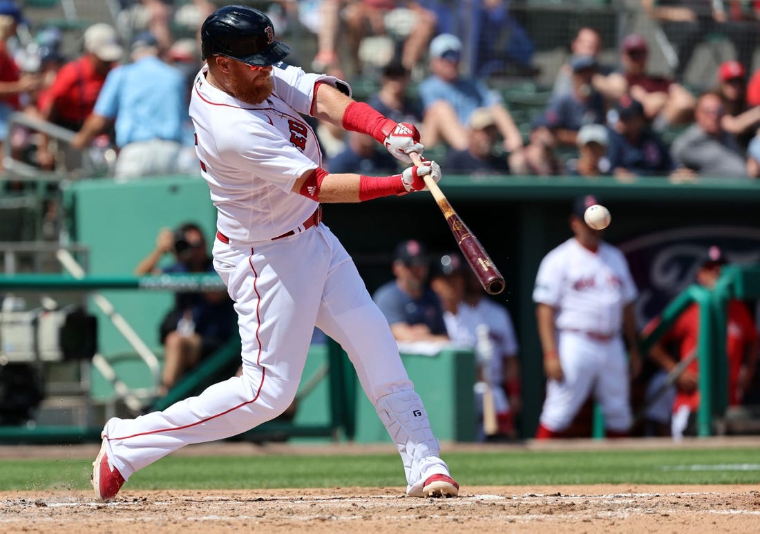 Mar 2, 2023; Fort Myers, Florida, USA;  Boston Red Sox third baseman Justin Turner (2) singles during the third inning against the Philadelphia Phillies at JetBlue Park at Fenway South. Mandatory Credit: Kim Klement-USA TODAY Sports