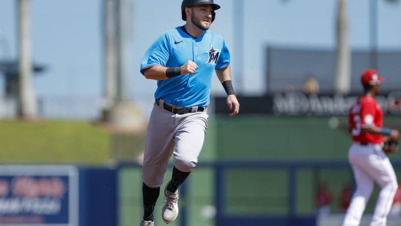 Mar 2, 2023; West Palm Beach, Florida, USA; Miami Marlins second baseman Garrett Hampson (1) runs toward third base during the second inning against the Washington Nationals at The Ballpark of the Palm Beaches. Mandatory Credit: Sam Navarro-USA TODAY Sports