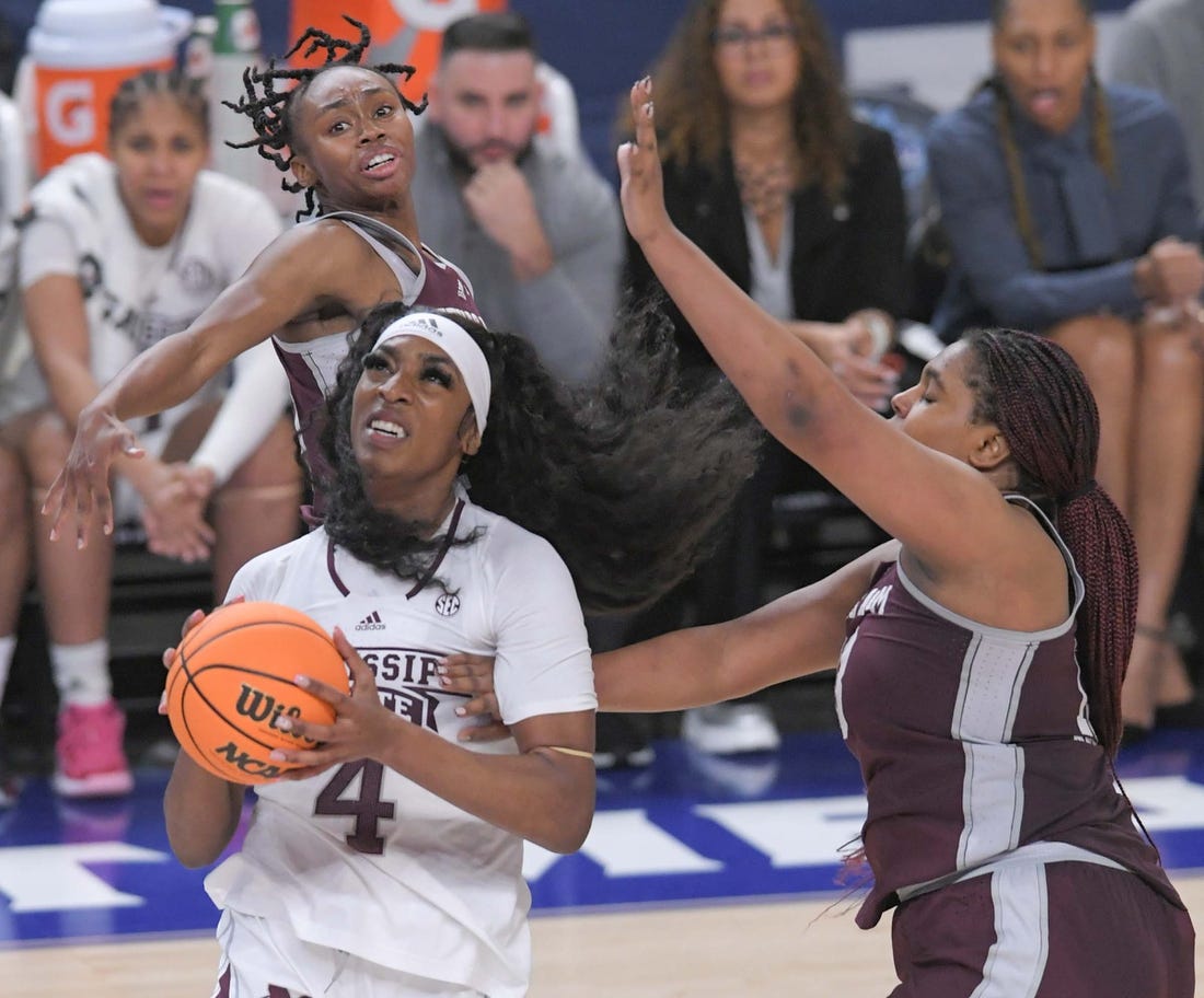 Mississippi State forward Jessika Carter (4) scores near Texas A&M forward Jada Malone (13) during the fourth quarter of the SEC Women's Basketball Tournament at Bon Secours Wellness Arena in Greenville, S.C. Thursday, March 2, 2023. Texas A&M won 79-72.

Texas A M Vs Mississippi State 2023 Sec Women S Basketball Tournament In Greenville Sc