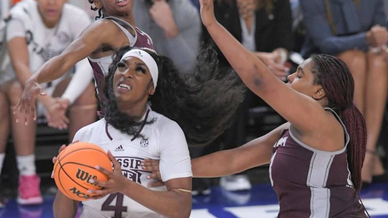 Mississippi State forward Jessika Carter (4) scores near Texas A&M forward Jada Malone (13) during the fourth quarter of the SEC Women's Basketball Tournament at Bon Secours Wellness Arena in Greenville, S.C. Thursday, March 2, 2023. Texas A&M won 79-72.

Texas A M Vs Mississippi State 2023 Sec Women S Basketball Tournament In Greenville Sc