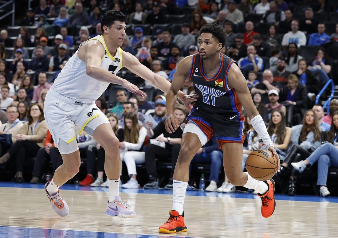 Mar 3, 2023; Oklahoma City, Oklahoma, USA; Oklahoma City Thunder guard Aaron Wiggins (21) drives to the basket against Utah Jazz forward Simone Fontecchio (16) during the second quarter at Paycom Center. Mandatory Credit: Alonzo Adams-USA TODAY Sports