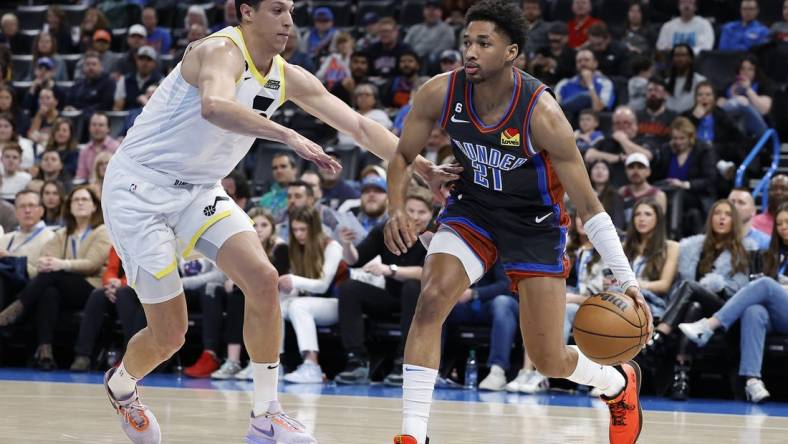 Mar 3, 2023; Oklahoma City, Oklahoma, USA; Oklahoma City Thunder guard Aaron Wiggins (21) drives to the basket against Utah Jazz forward Simone Fontecchio (16) during the second quarter at Paycom Center. Mandatory Credit: Alonzo Adams-USA TODAY Sports