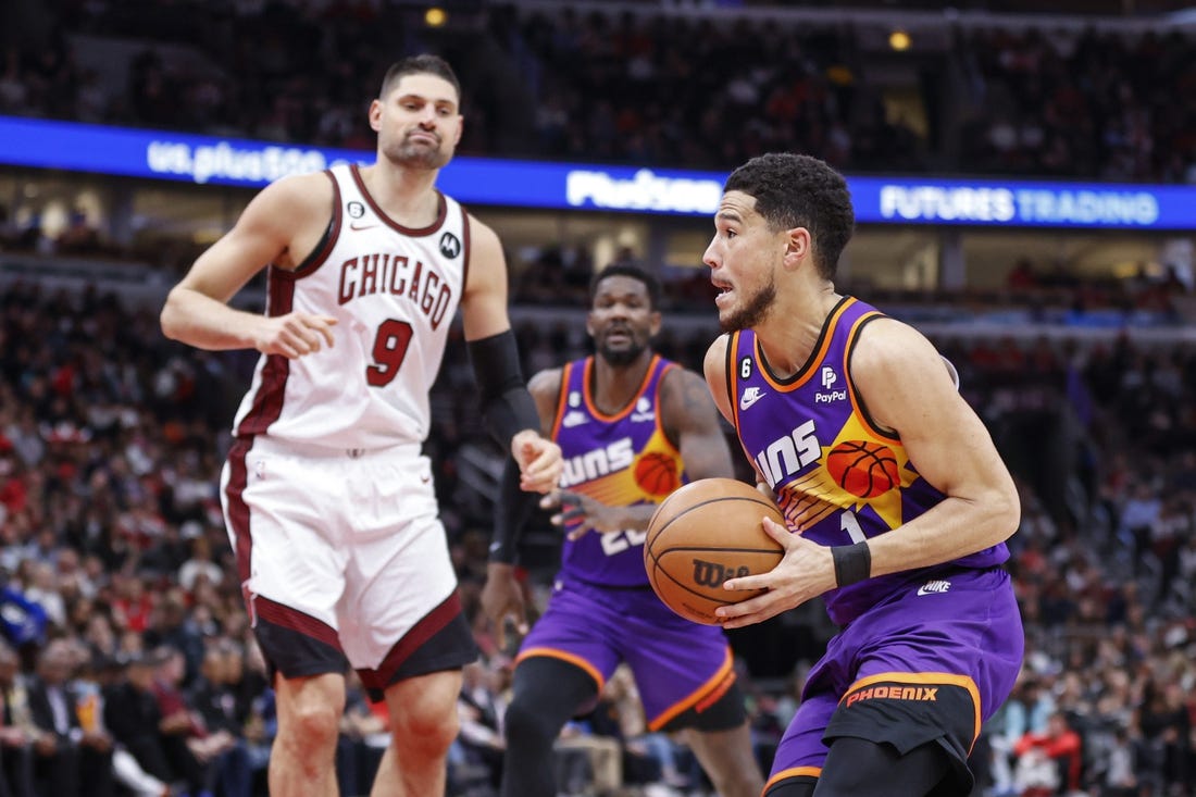 Mar 3, 2023; Chicago, Illinois, USA; Phoenix Suns guard Devin Booker (1) drives to the basket against the Chicago Bulls during the first half at United Center. Mandatory Credit: Kamil Krzaczynski-USA TODAY Sports