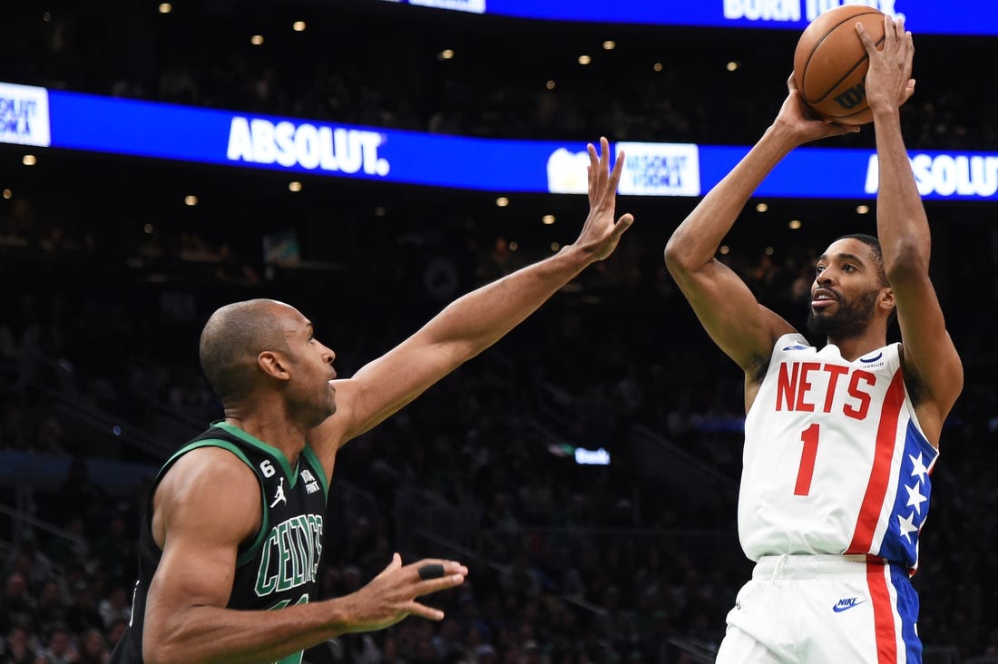 Mar 3, 2023; Boston, Massachusetts, USA;  Brooklyn Nets forward Mikal Bridges (1) shoots the ball over Boston Celtics center Al Horford (42) during the first half at TD Garden. Mandatory Credit: Bob DeChiara-USA TODAY Sports