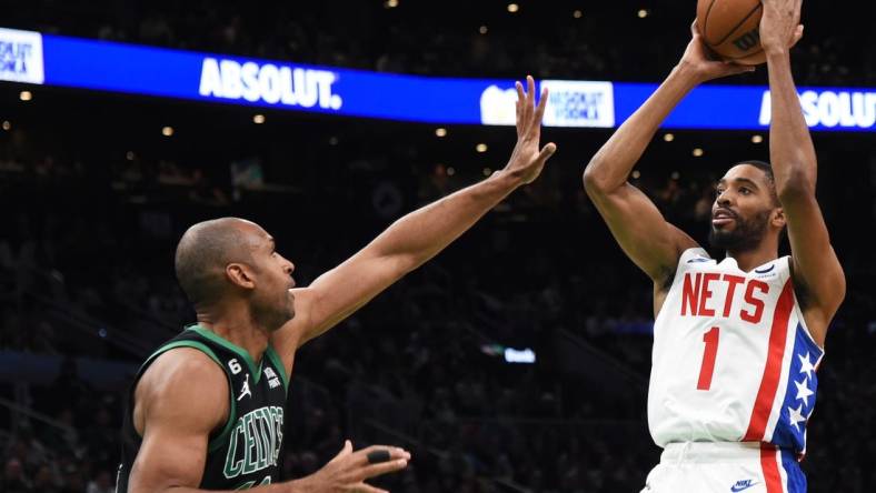 Mar 3, 2023; Boston, Massachusetts, USA;  Brooklyn Nets forward Mikal Bridges (1) shoots the ball over Boston Celtics center Al Horford (42) during the first half at TD Garden. Mandatory Credit: Bob DeChiara-USA TODAY Sports