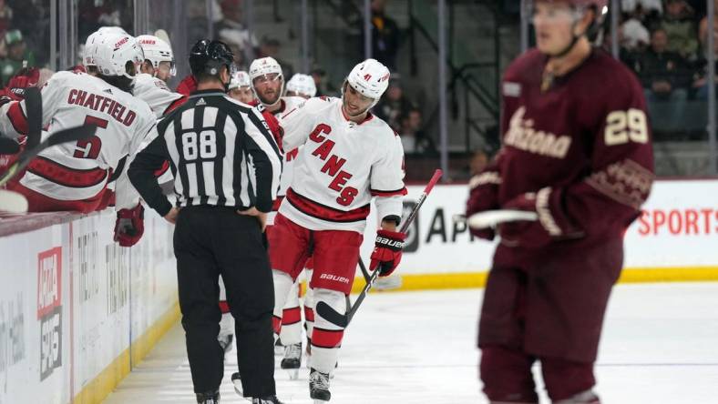 Mar 3, 2023; Tempe, Arizona, USA; Carolina Hurricanes defenseman Shayne Gostisbehere (41) celebrates his goal against the Arizona Coyotes during the second period at Mullett Arena. Mandatory Credit: Joe Camporeale-USA TODAY Sports