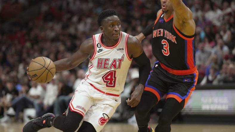 Mar 3, 2023; Miami, Florida, USA;  Miami Heat guard Victor Oladipo (4) drives to the basket past New York Knicks guard Josh Hart (3) during the second half at Miami-Dade Arena. Mandatory Credit: Jim Rassol-USA TODAY Sports