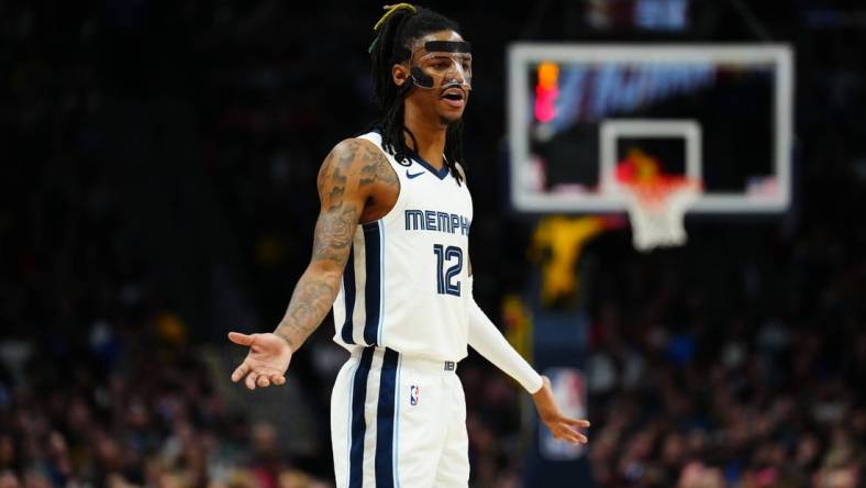 Mar 3, 2023; Denver, Colorado, USA; Memphis Grizzlies guard Ja Morant (12) reacts to a foul called in the second half against the Denver Nuggets at Ball Arena. Mandatory Credit: Ron Chenoy-USA TODAY Sports