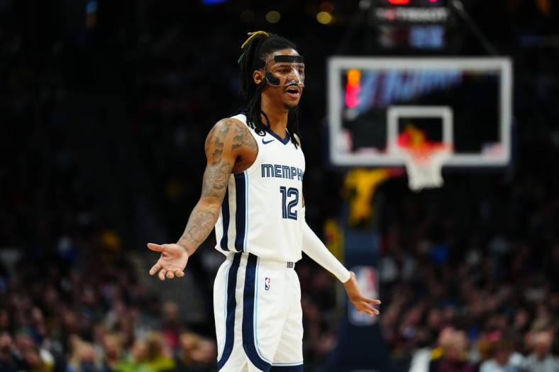 Mar 3, 2023; Denver, Colorado, USA; Memphis Grizzlies guard Ja Morant (12) reacts to a foul called in the second half against the Denver Nuggets at Ball Arena. Mandatory Credit: Ron Chenoy-USA TODAY Sports