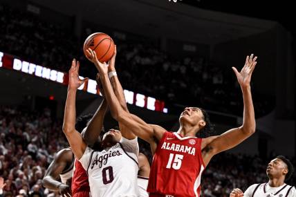 Mar 4, 2023; College Station, Texas, USA;  Alabama Crimson Tide forward Noah Clowney (15) and Texas A&M Aggies guard Dexter Dennis (0) go for the rebound during the first half at Reed Arena. Mandatory Credit: Maria Lysaker-USA TODAY Sports