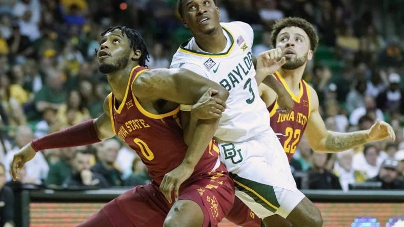 Mar 4, 2023; Waco, Texas, USA; Iowa State Cyclones forward Tre King (0) boxes out  Baylor Bears guard Dale Bonner (3) on a free throw during the second half at Ferrell Center. Mandatory Credit: Raymond Carlin III-USA TODAY Sports