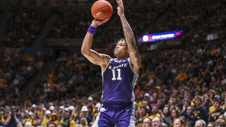 Mar 4, 2023; Morgantown, West Virginia, USA; Kansas State Wildcats forward Keyontae Johnson (11) shoots a three point basket during the first half against the West Virginia Mountaineers at WVU Coliseum. Mandatory Credit: Ben Queen-USA TODAY Sports