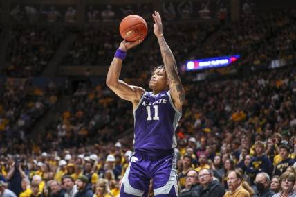 Mar 4, 2023; Morgantown, West Virginia, USA; Kansas State Wildcats forward Keyontae Johnson (11) shoots a three point basket during the first half against the West Virginia Mountaineers at WVU Coliseum. Mandatory Credit: Ben Queen-USA TODAY Sports