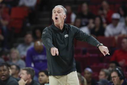 Mar 4, 2023; Norman, Oklahoma, USA; TCU Horned Frogs head coach Jamie Dixon gestures to his team on a play against the Oklahoma Sooners during the first half at Lloyd Noble Center. Mandatory Credit: Alonzo Adams-USA TODAY Sports