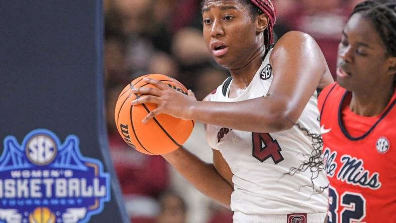 Mar 4, 2023; Greenville, SC, USA; South Carolina forward Aliyah Boston (4) rebounds the ball against Mississippi forward Madison Scott (24) during the fourth quarter at Bon Secours Wellness Arena. Mandatory Credit: Ken Ruinard-USA TODAY Sports