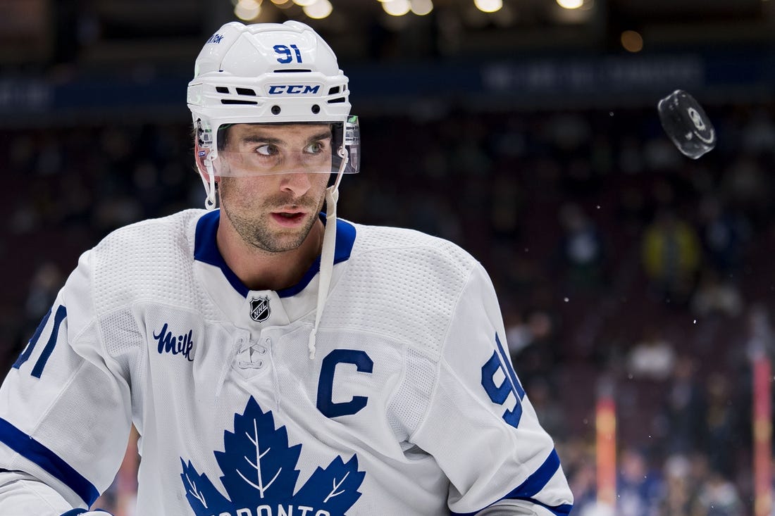 Mar 4, 2023; Vancouver, British Columbia, CAN; Toronto Maple Leafs forward John Tavares (91) handles the puck  during warm up prior to a game against the Vancouver Canucks at Rogers Arena. Mandatory Credit: Bob Frid-USA TODAY Sports