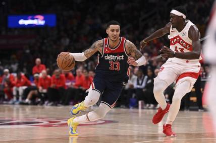 Mar 4, 2023; Washington, District of Columbia, USA;  Washington Wizards forward Kyle Kuzma (33) makes a move to the basket as Toronto Raptors forward Pascal Siakam (43) defends during the during over time at Capital One Arena. Mandatory Credit: Tommy Gilligan-USA TODAY Sports