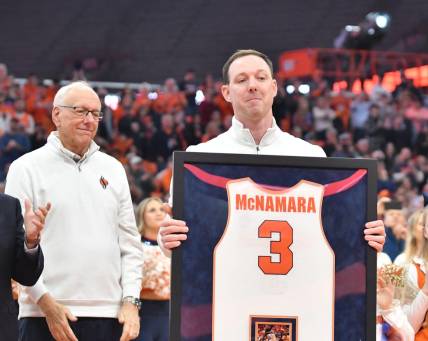 Mar 4, 2023; Syracuse, New York, USA; Syracuse Orange  former player Gerry McNamara holds his framed jersey during a ceremony to retire his number at JMA Wireless Dome. Mandatory Credit: Mark Konezny-USA TODAY Sports
