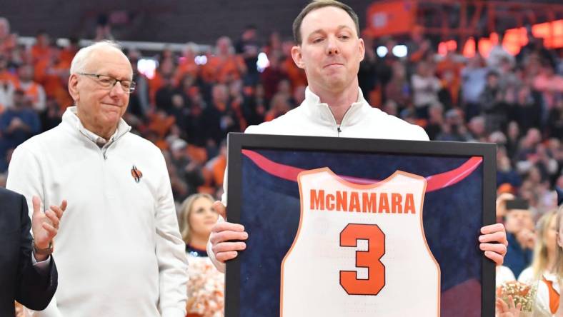 Mar 4, 2023; Syracuse, New York, USA; Syracuse Orange  former player Gerry McNamara holds his framed jersey during a ceremony to retire his number at JMA Wireless Dome. Mandatory Credit: Mark Konezny-USA TODAY Sports