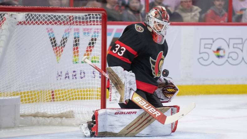 Mar 4, 2023; Ottawa, Ontario, CAN: Ottawa Senators goalie Cam Talbot (33) makes a save in the second period against the Columbus Blue Jackets  at the Canadian Tire Centre. Mandatory Credit: Marc DesRosiers-USA TODAY Sports