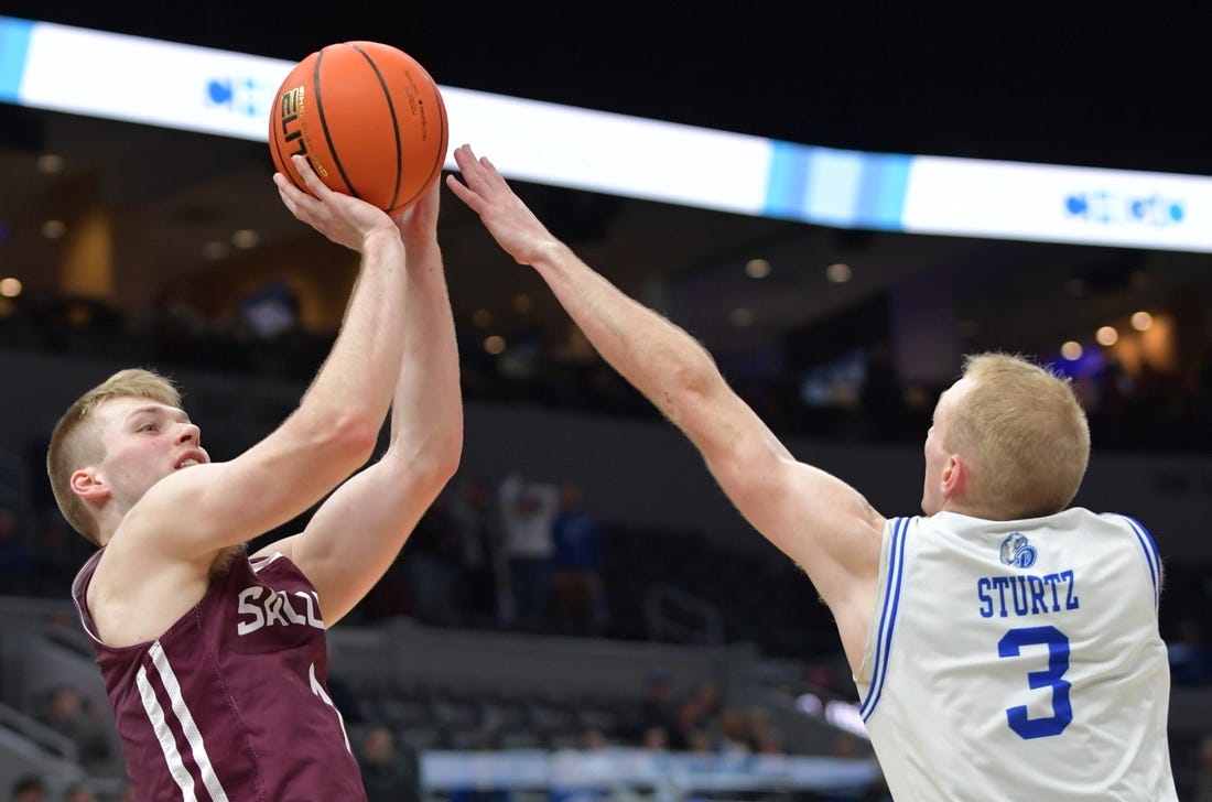 Mar 4, 2023; St. Louis, MO, USA;  Southern Illinois Salukis forward Marcus Domask (1) shoots over Drake Bulldogs guard Garrett Sturtz (3) during the second half at Enterprise Center. Mandatory Credit: Ron Johnson-USA TODAY Sports