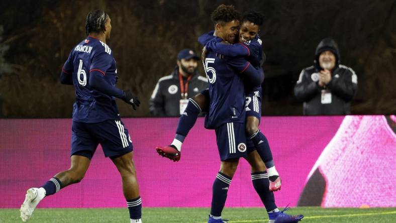 Mar 4, 2023; Foxborough, Massachusetts, USA; New England Revolution defender Brandon Bye (15) celebrates scoring a goal with forward Latif Blessing (19) in the second half against the Houston Dynamo FC at Gillette Stadium. Mandatory Credit: Winslow Townson-USA TODAY Sports