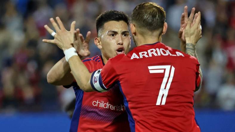 Mar 4, 2023; Frisco, Texas, USA; FC Dallas forward Alan Velasco (20) celebrates with forward Paul Arriola (7) after scoring a goal against the Los Angeles Galaxy during the first half at Toyota Stadium. Mandatory Credit: Kevin Jairaj-USA TODAY Sports