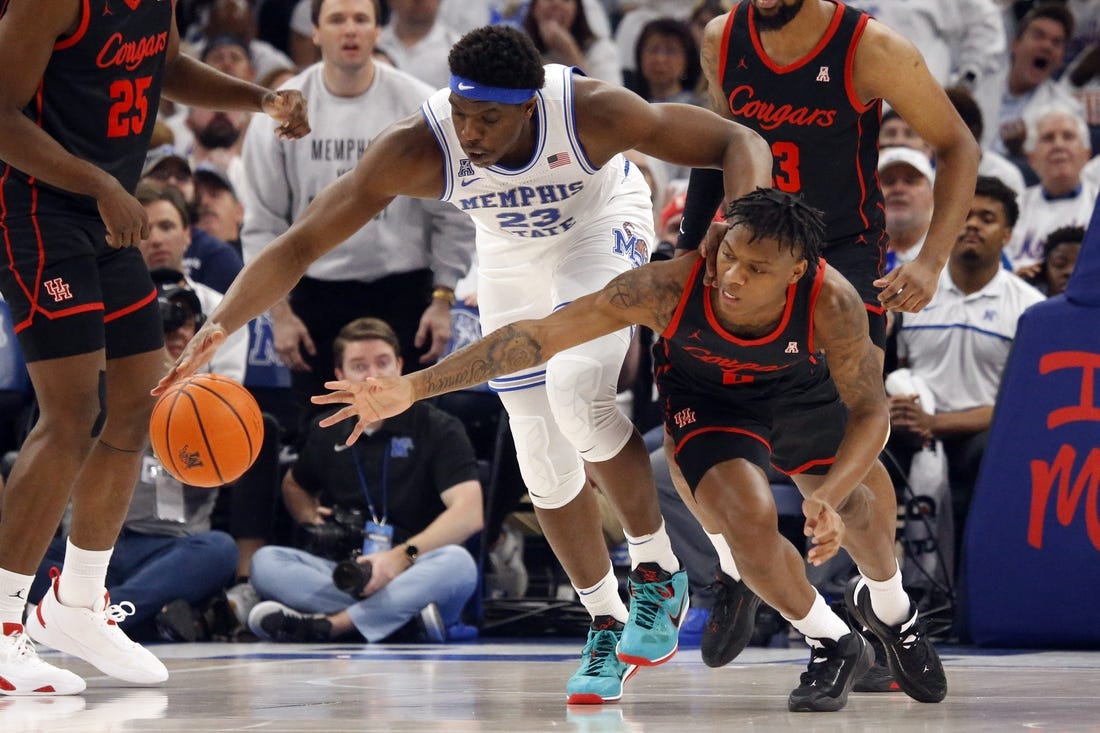 Mar 5, 2023; Memphis, Tennessee, USA; Memphis Tigers forward Malcolm Dandridge (23) and Houston Cougars guard Marcus Sasser (0) battle for a loose ball during the first half at FedExForum. Mandatory Credit: Petre Thomas-USA TODAY Sports