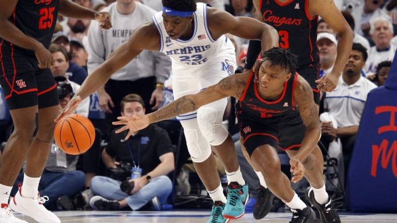 Mar 5, 2023; Memphis, Tennessee, USA; Memphis Tigers forward Malcolm Dandridge (23) and Houston Cougars guard Marcus Sasser (0) battle for a loose ball during the first half at FedExForum. Mandatory Credit: Petre Thomas-USA TODAY Sports